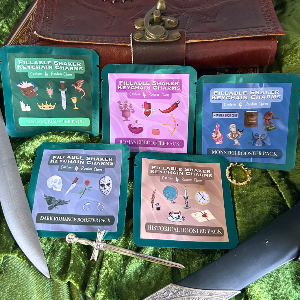 Collection of 'Fillable Shaker' booster packs on a green fabric background with decorative elements.