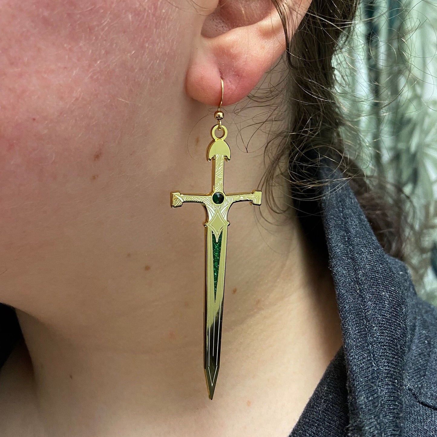 Fantasy bookish emerald earrings with a glossy enamel finish, available in gold and silver options.